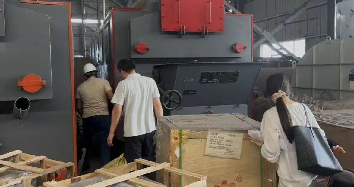 JINHONG technical team reviewing boiler equipment before delivery
