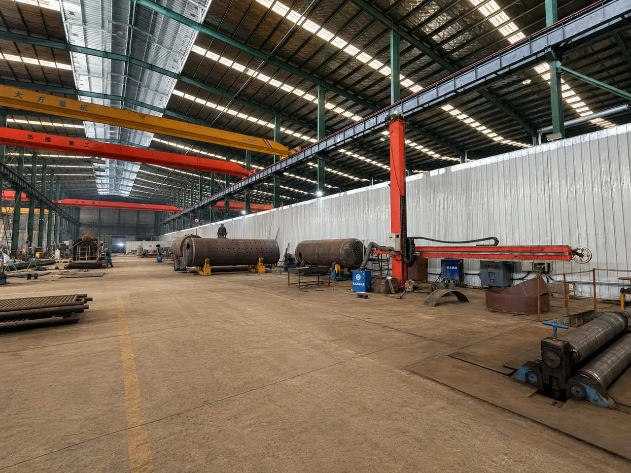 Steel tubes and fabrication area inside the JINHONG Boiler workshop