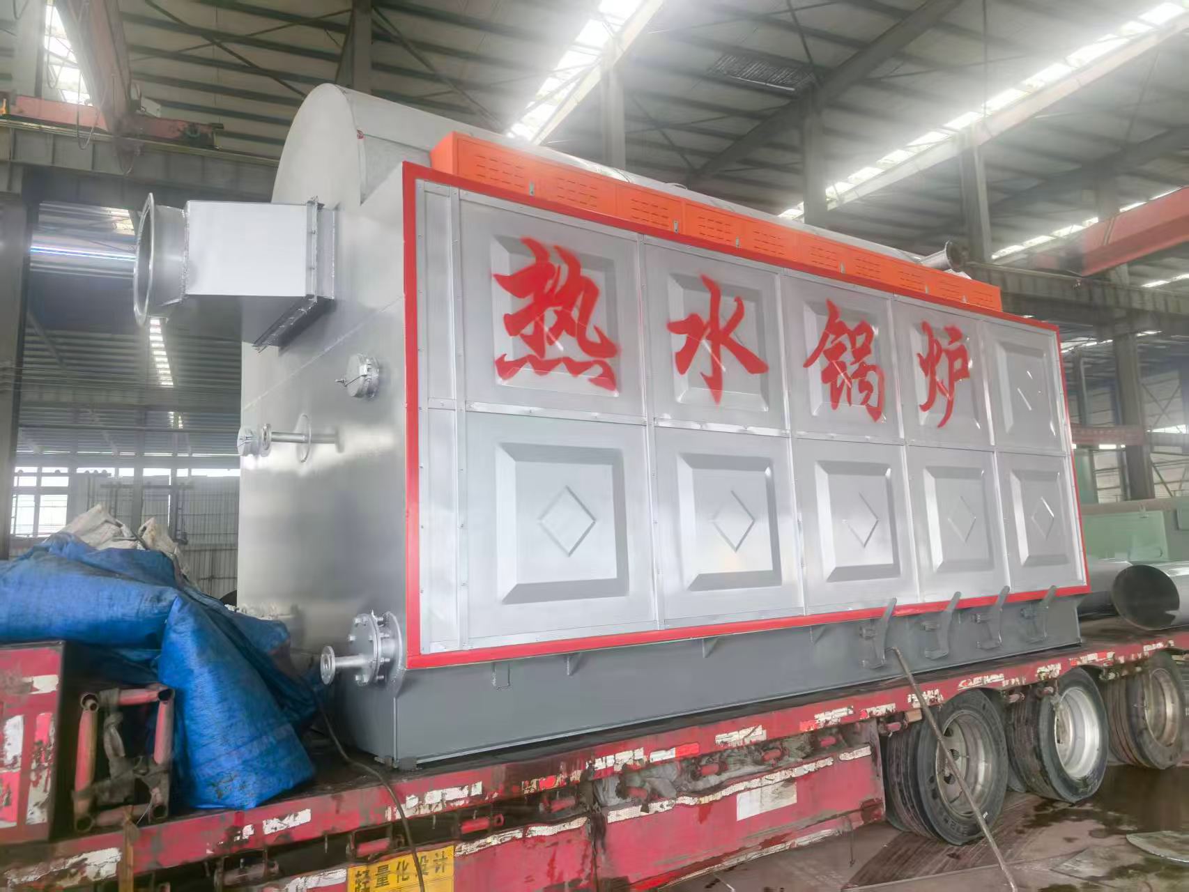 Side view of the 2.8 MW coal and wood hot water boiler for the Kazakhstan residential heating project