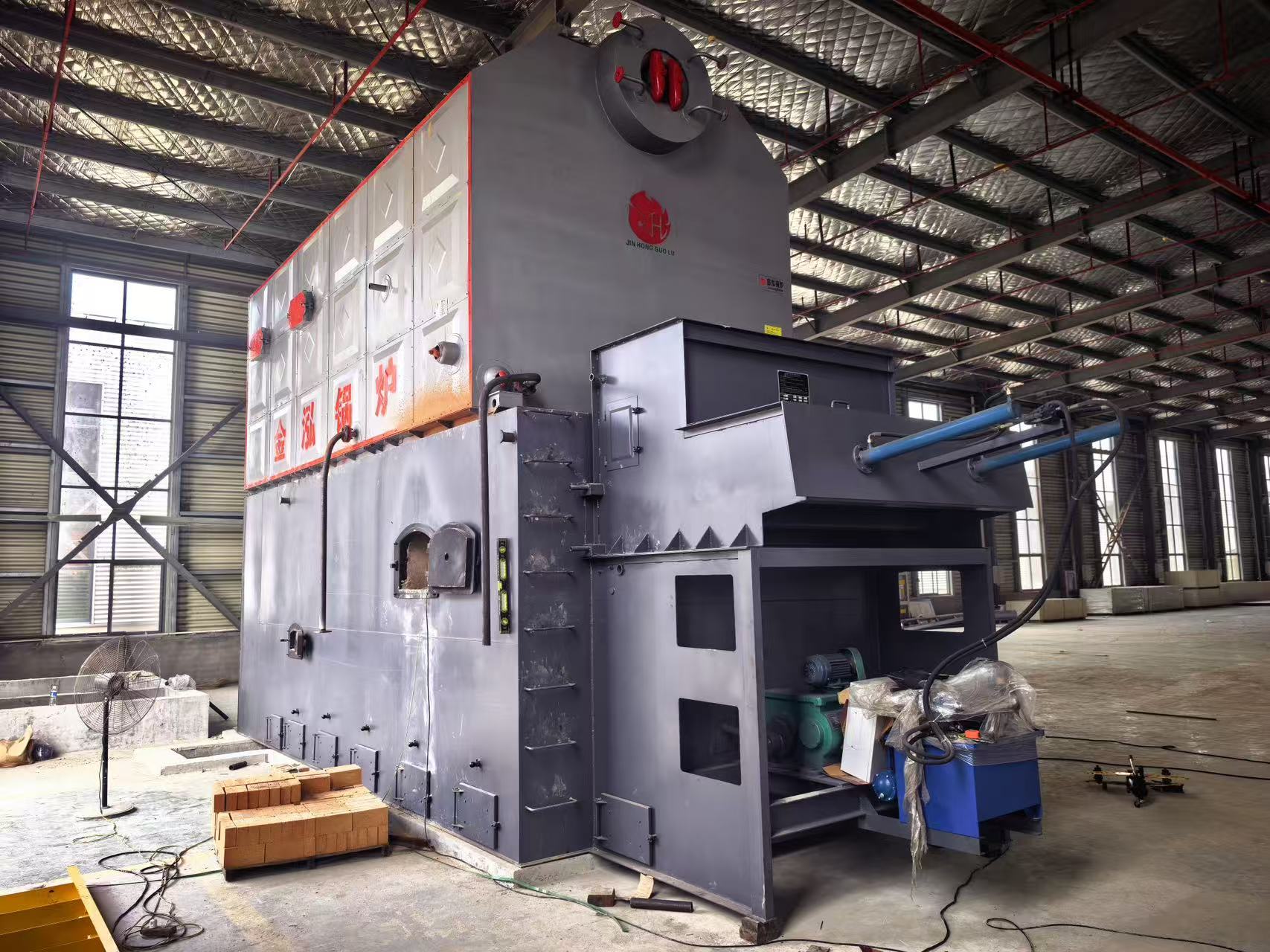 Overall view of the DZH8-1.25-SCI biomass steam boiler and front feeding equipment for the Kenya project