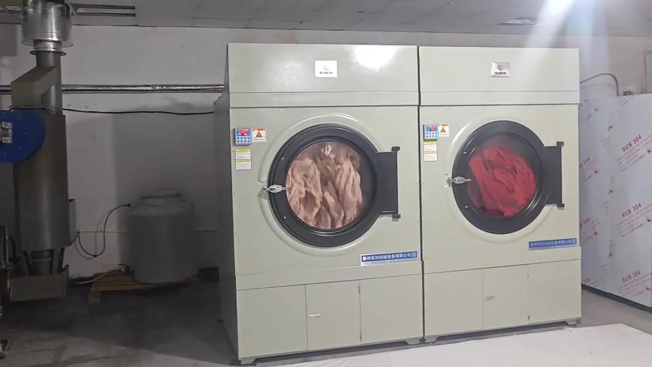 Laundry loads inside two industrial tumble dryers at the operating Malaysia project